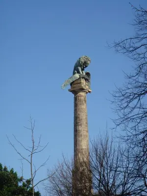 a statue on top of a pole with trees at DISCOVER PORTO - Boavista 3 in Porto