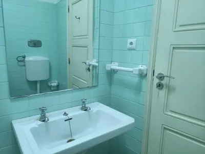 a bathroom with a sink and a mirror at DISCOVER PORTO - Boavista 3 in Porto