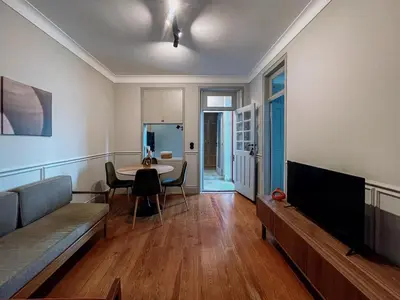 a living room with a couch and a table at Prédio da Estação in Porto