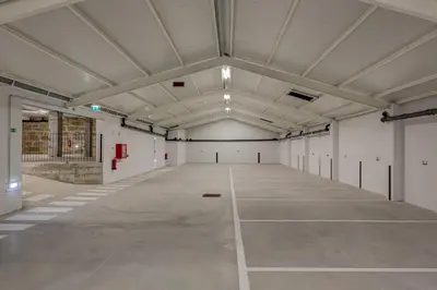 a large empty room with a large ceiling at Blissful Suites Porto by gaiarooms in Porto