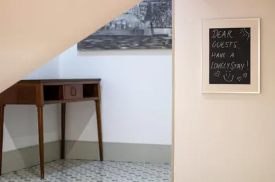 a kitchen with a table and chairs in a room at Central Stunning Duplex w/ Patio by LovelyStay in Porto