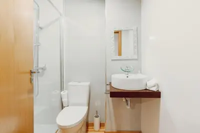 a bathroom with a toilet and a sink at Papa Apartment with Terrace in Porto