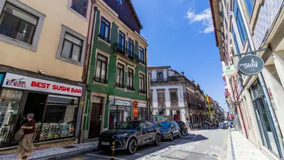 a city street with cars parked on the street at Formosa Delight by LovelyStay in Porto