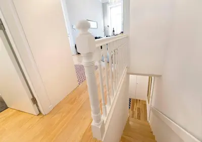 a white staircase in a home with a white railing at Porto's Legacy by Upperground in Porto