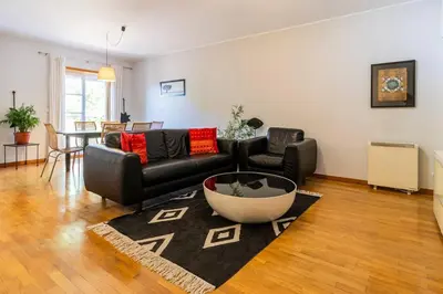 a living room with a couch and a table at Casa da Praça in the center of Porto - GuestSPA in Porto