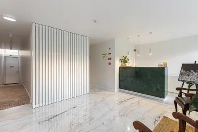a living room with a large glass wall at Soho Porto in Porto