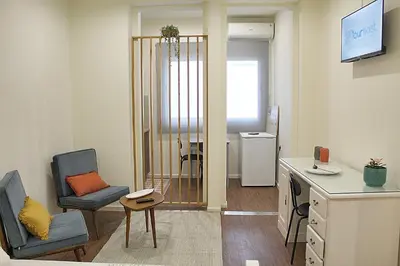 a small living room with a desk and a chair at Oporto Sweet Downtown 4 in Porto