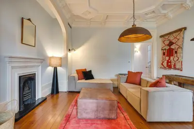 a living room with a couch and a fireplace at Porto Premium Villa in Porto