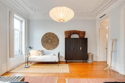 a living room with a couch and a chandelier at Porto Premium Villa in Porto