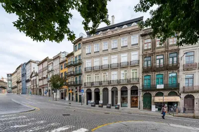 a row of buildings on a city street at Mouzinho 32 in Porto