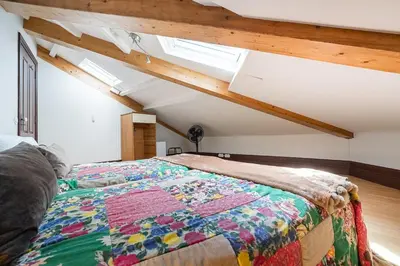 a bedroom with a bed with a quilt on it at GuestReady - Belle Epoque Apartments in Porto