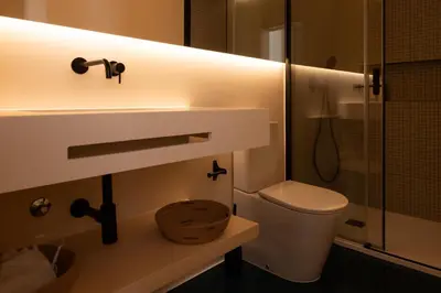a bathroom with a toilet and a shower at Stylish Downtown Loft in Porto