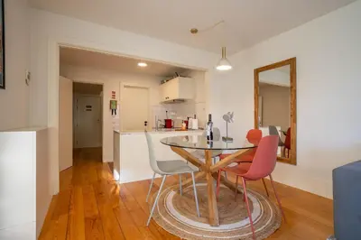 a kitchen and dining room with a table and chairs at Historical Downtown Retreat Duplex by LovelyStay in Porto