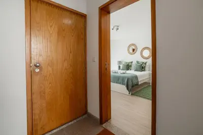 a door leading to a bedroom with a bed at Rooftop Stylish by Hosty in Porto