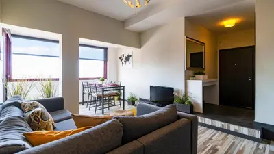 a living room with a couch and a table at Abadia by LovelyStay in Porto