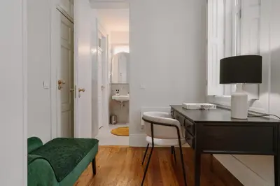 a room with a desk and a chair and a sink at Romantic Luxury House w Captivating Outdoor Patio in Porto