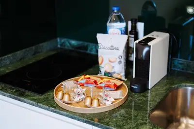 a plate of food on a counter next to a microwave at Exclusive Charm House in Porto