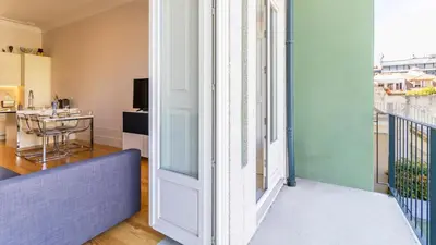 a view of a living room with a balcony at Duque Flat - AC & Balcony by LovelyStay in Porto
