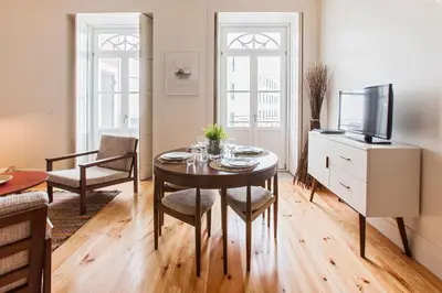 a living room with a table and a tv at bnapartments Loftpuzzle in Porto