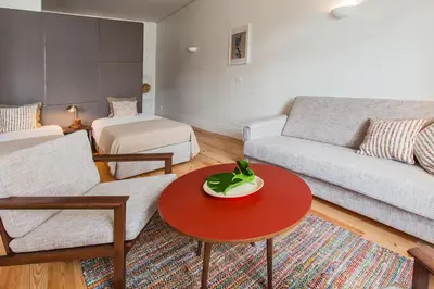 a living room with a couch and a table at bnapartments Loftpuzzle in Porto