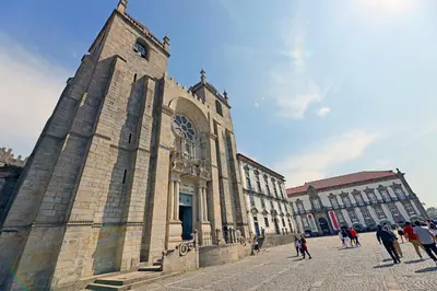 a group of people walking in front of a building at FLH Boavista Wooden Flats in Porto