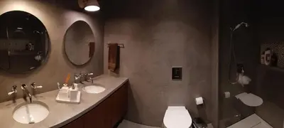a bathroom with two sinks and a shower and two mirrors at Portus Cale by LovelyStay in Vila Nova de Gaia