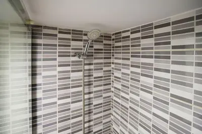 a shower with a shower head in a bathroom at So Simply Ribeira in Porto