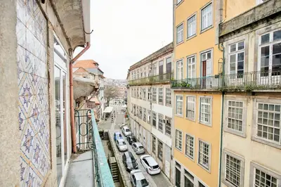 a view of a city street with cars parked at So Simply Ribeira in Porto