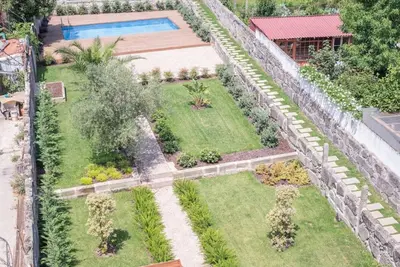 an aerial view of a garden with a swimming pool at Truly Porto in Porto