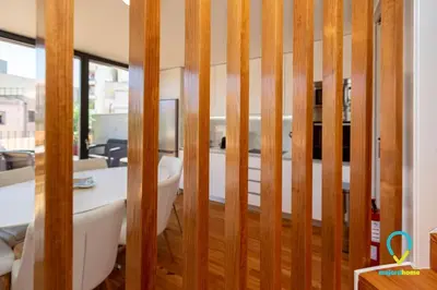 a room with a wooden partition with a table at So Trendy Porto in Porto