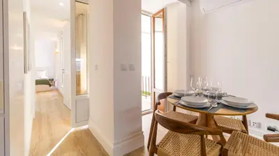 a dining room with a table and chairs at Urban House Marquês by LovelyStay in Porto