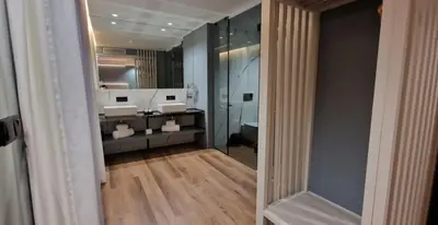a hotel room with a bed and a mirror at Bom Sucesso Hotel by gaiarooms in Porto
