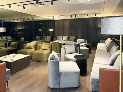 a lobby with couches and tables in a building at Bom Sucesso Hotel by gaiarooms in Porto