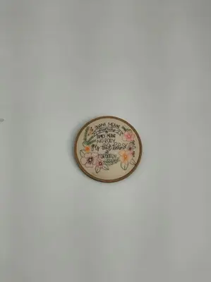 a plate with flowers on it on a white wall at Constituição 1012 in Porto