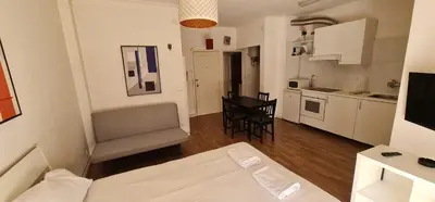 a small apartment with a kitchen and a living room at Constituição 1012 in Porto