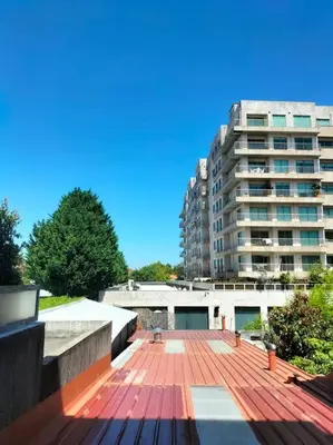 a view of a large building with a red deck at Constituição 1012 in Porto