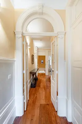 an archway in a hallway with a piano at Downtown Grand Houses in Porto