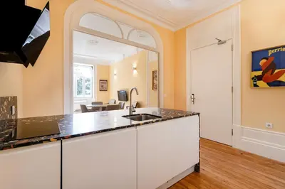 a kitchen with a sink and a counter top at Downtown Grand Houses in Porto