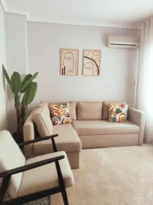 a bedroom with a bed and a table and a mirror at Home Essences in Porto