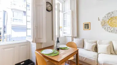 a living room with a table and a couch at Boavista Loft by LovelyStay in Porto