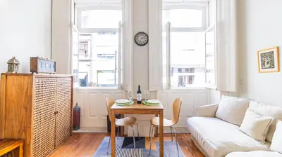 a living room with a table and a couch at Boavista Loft by LovelyStay in Porto