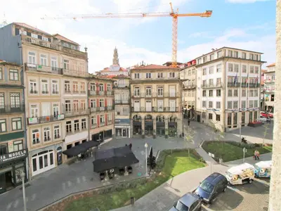 a view of a city with buildings and a crane at ALIADOS by YoursPorto in Porto