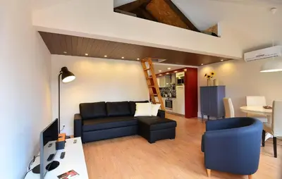 a living room with a couch and a table at Welcome to my city in Porto