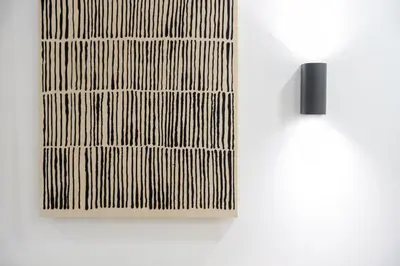 a wooden picture hanging on a white wall at Porto Calm Terrace Apartment in Porto