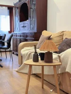 a living room with a table with a lamp on it at Downtown 2 minutes by walk to center and metro-direct to airpot T4 in Porto