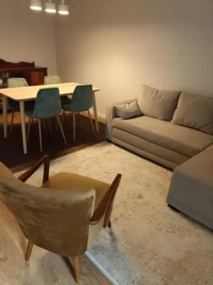 a living room with a couch and a table and chairs at Gaia Loves You - Serra do Pilar in Vila Nova de Gaia