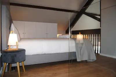 a bedroom with a bed and a table with a lamp at Gaia Loves You - Jardim do Morro in Vila Nova de Gaia