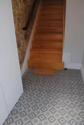a hallway with a tile floor and stairs at Gaia Loves You - Jardim do Morro in Vila Nova de Gaia