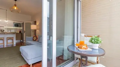a room with a table and a living room at Urban Retreat Porto by LovelyStay in Porto