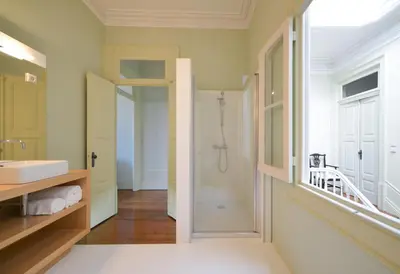 a bathroom with a shower and a sink at Maison des Amis Porto in Porto